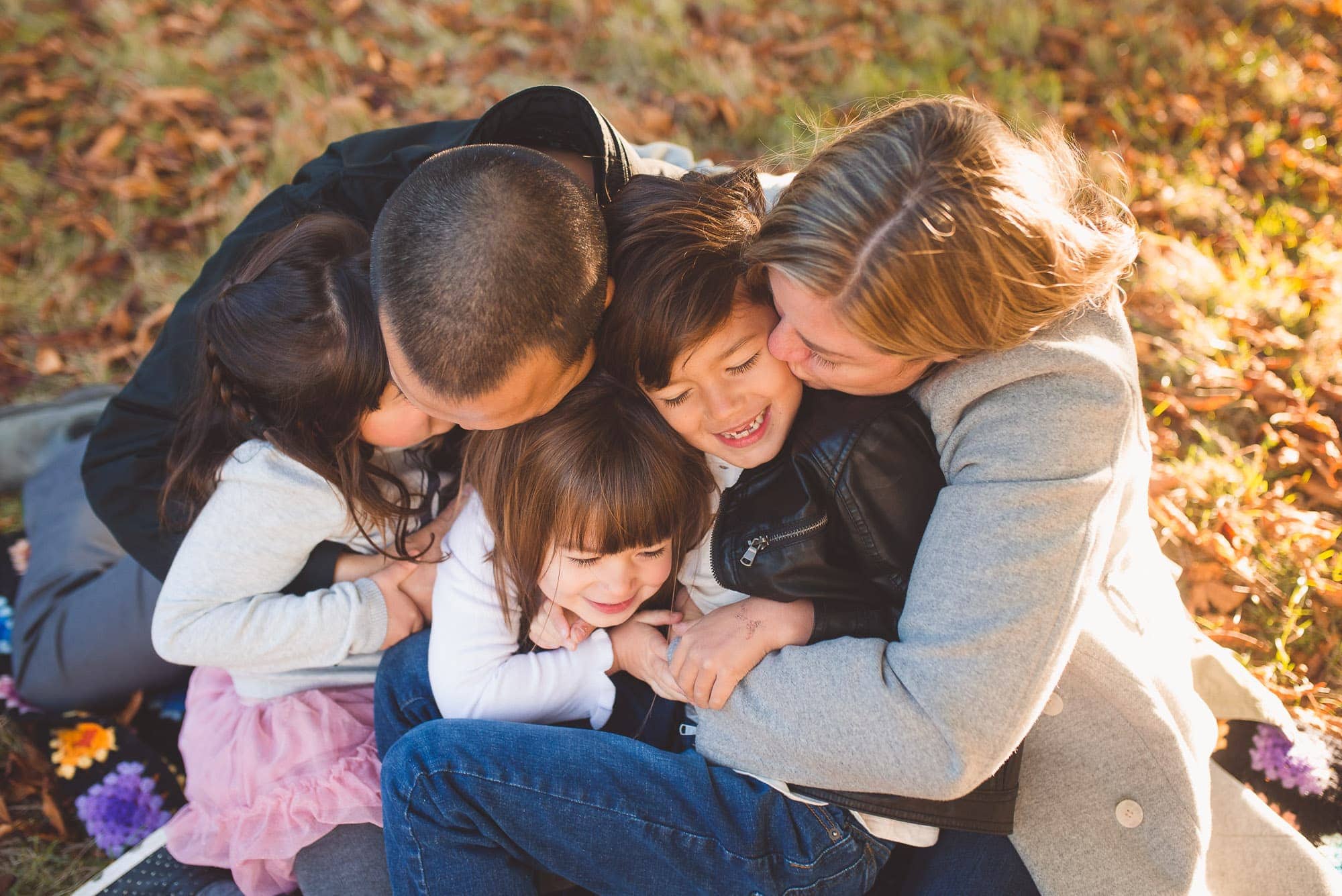 Family hugs and cuddles captured by Vancouver Family Photographer