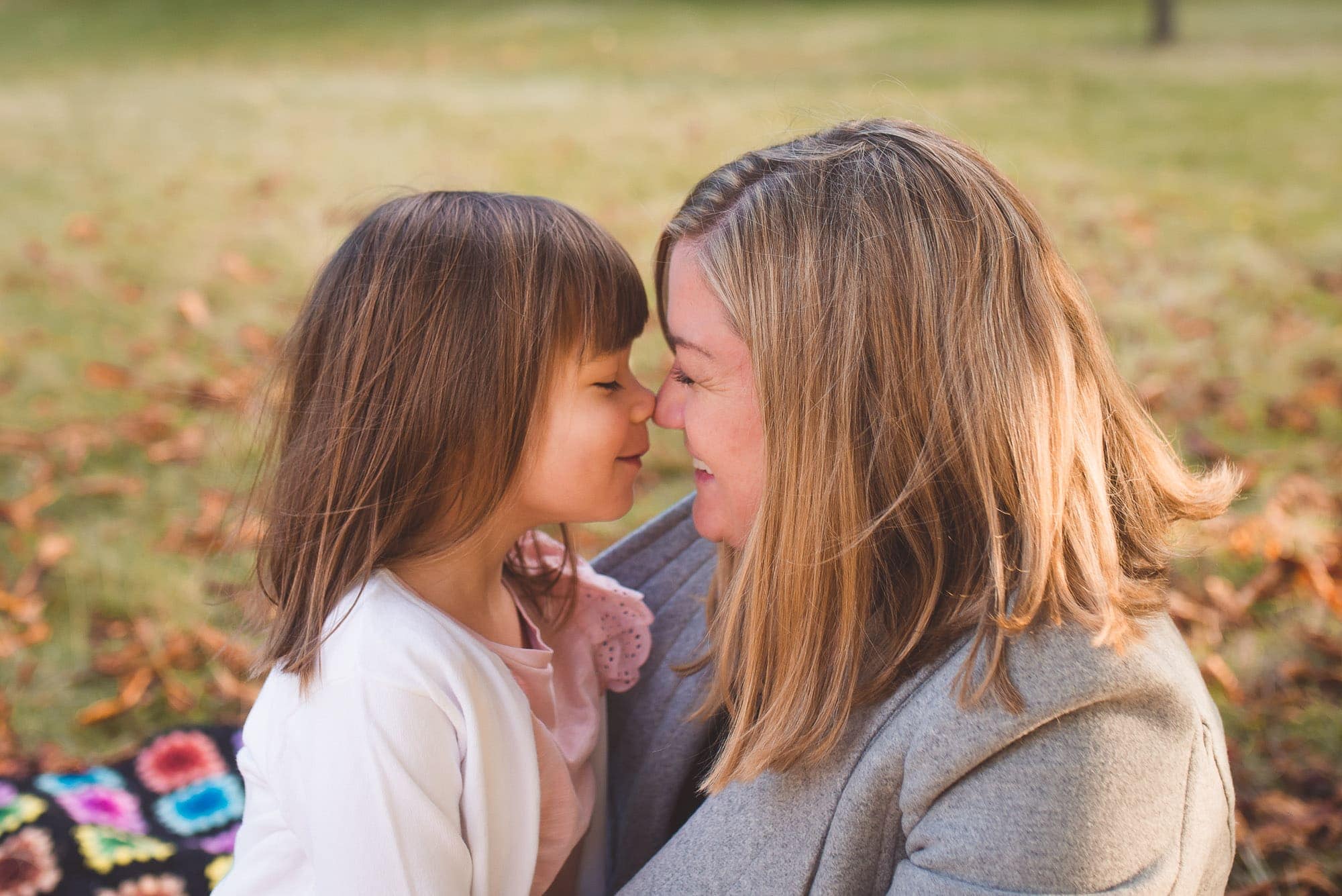 mom and daughter give nose kisses in Vancouver family photography session
