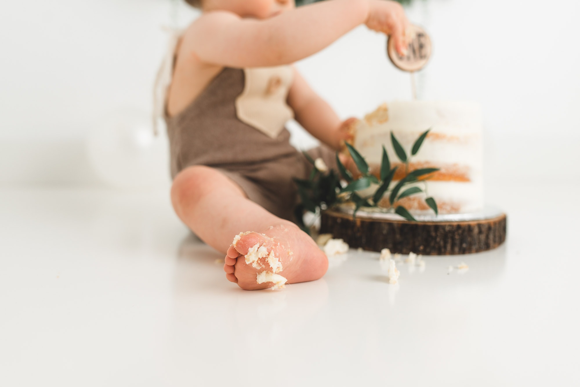 close up of baby foot during cake smash