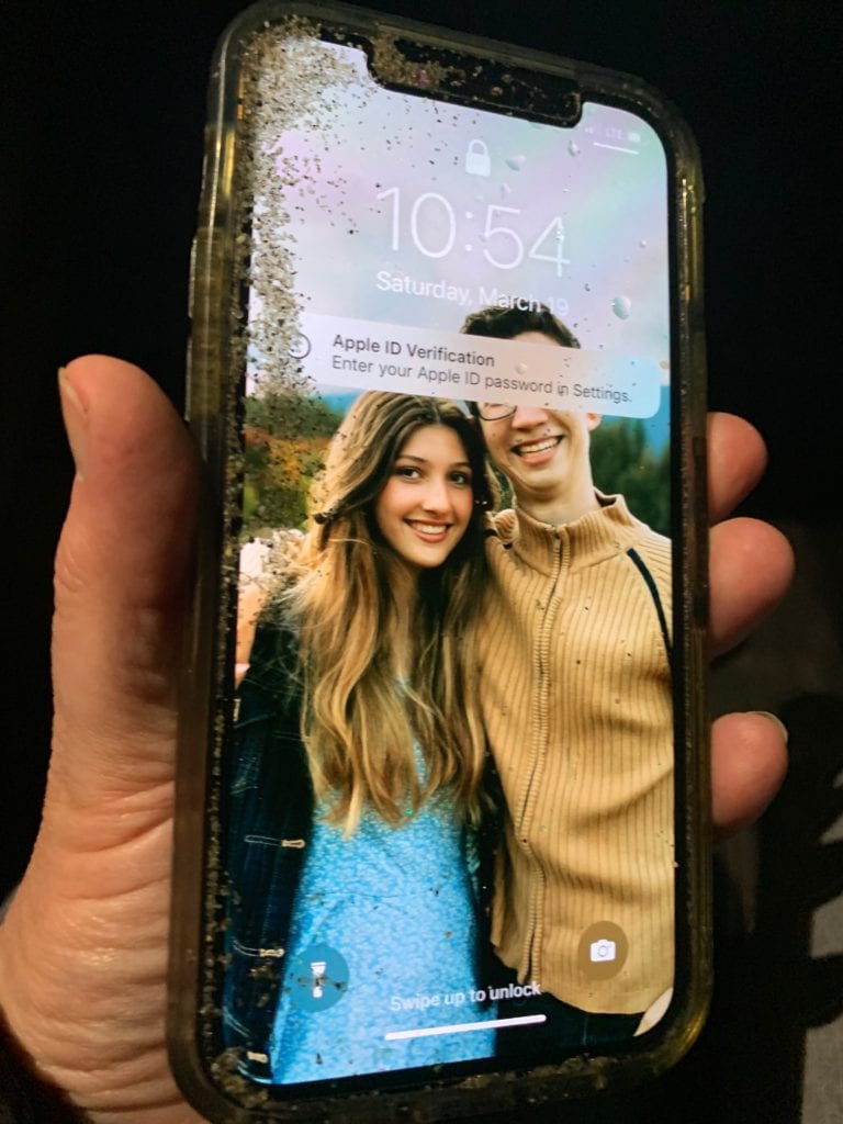 iPhone 12 after being submerged in water with reminder to back up your photos