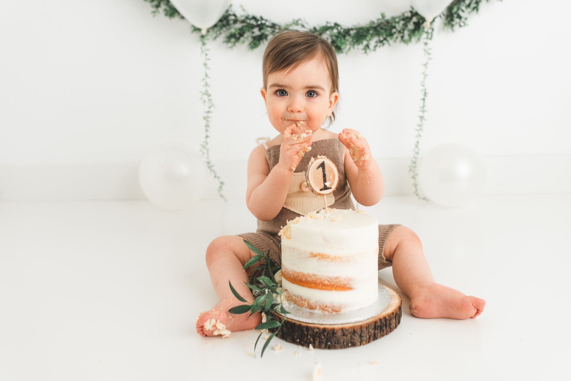 one year old eating smash cake in Coquitlam