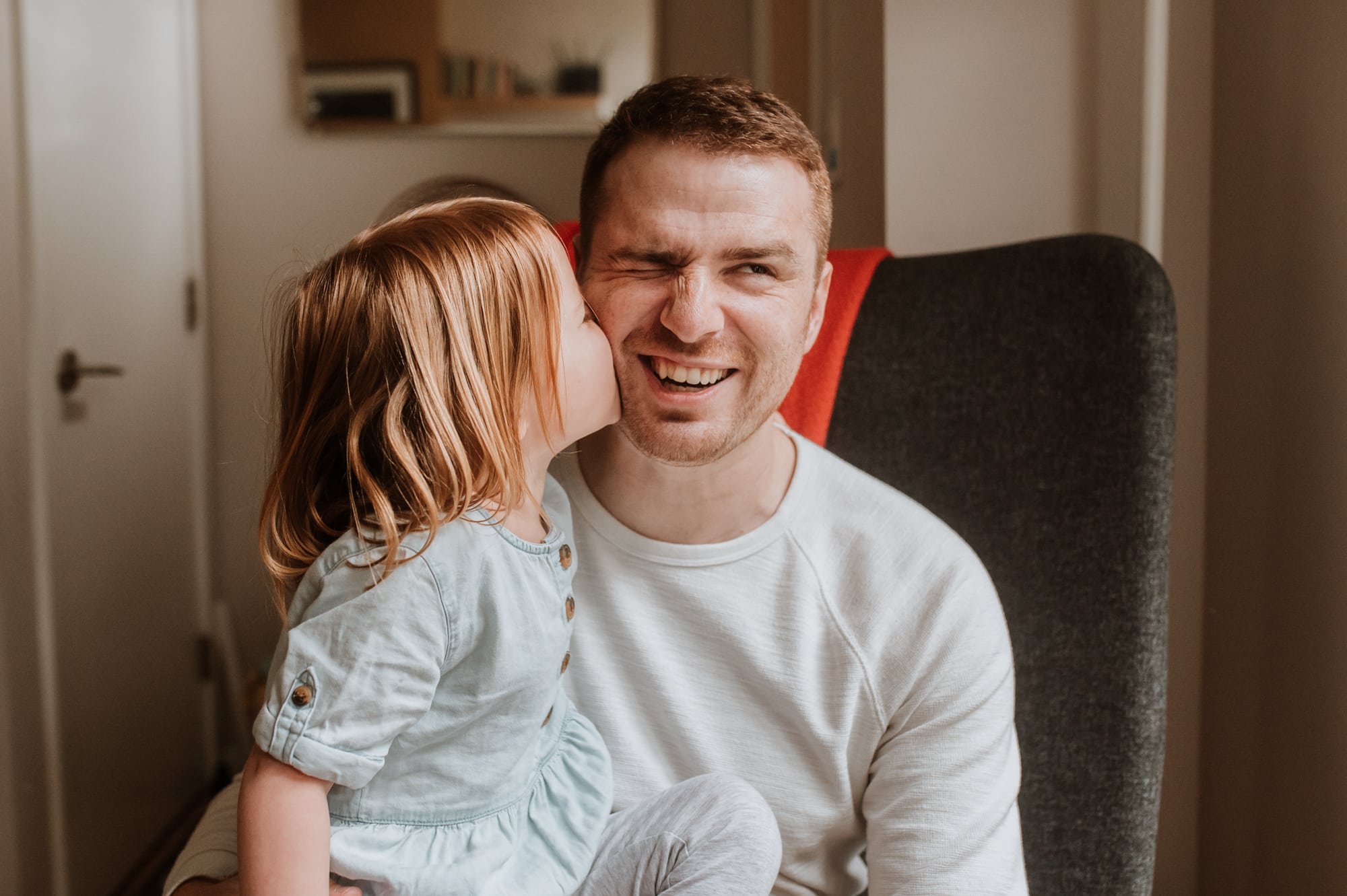 Silly dad and daughter kissing moment in Vancouver family session