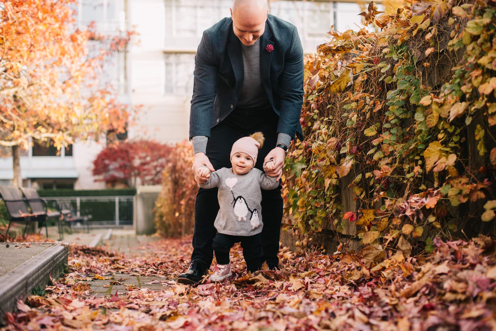 This Vancouver fall family photography session shows dad walking with his daughter on a chilly autumn day.